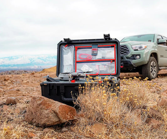 Open Pelican protective case in harsh outdoor environment, illustrating pelican protector cases built for extreme use