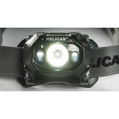 Pelican tactical light shown on table, highlighting its compact size and durable, mission-ready construction.
